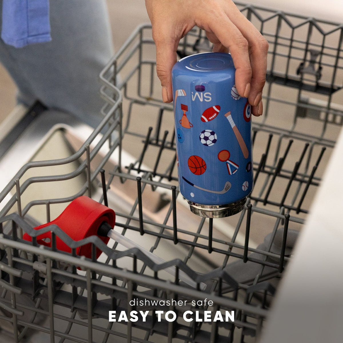 Blue Simple Modern kids water bottle with sports graphics held above open dishwasher, showing dishwasher-safe feature. Text reads "Dishwasher Safe, Easy to Clean."