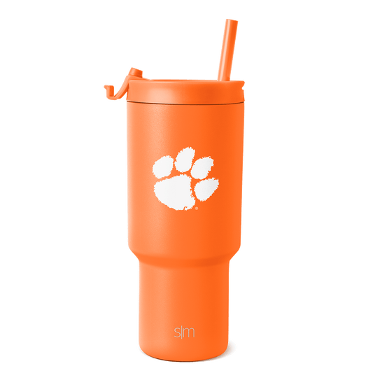 Bright orange tumbler with white paw print graphic and brand text
