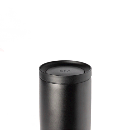 Voyager Signature 360 push button lid in matte black with gray undertones, featuring a dark charcoal finish against a light gray background.